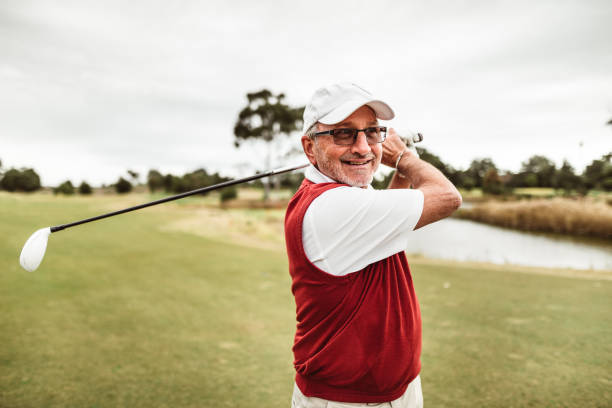 golf player hitting the ball with a recommended golf club for seniors.